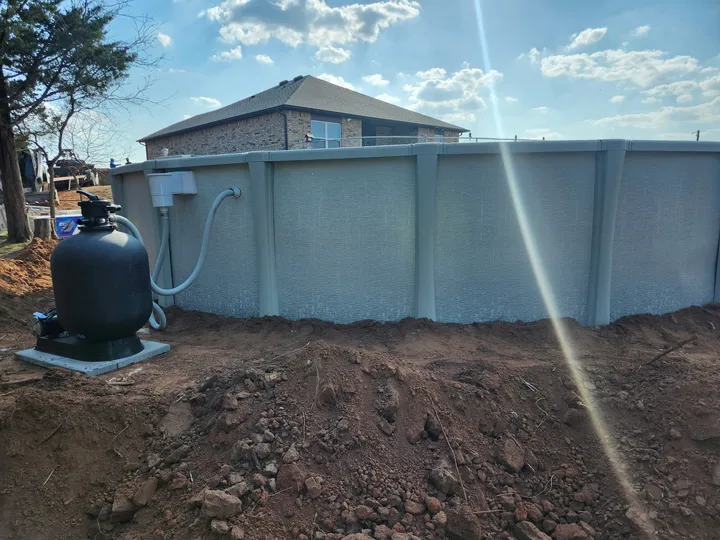 Completed above-ground pool wall with filter system