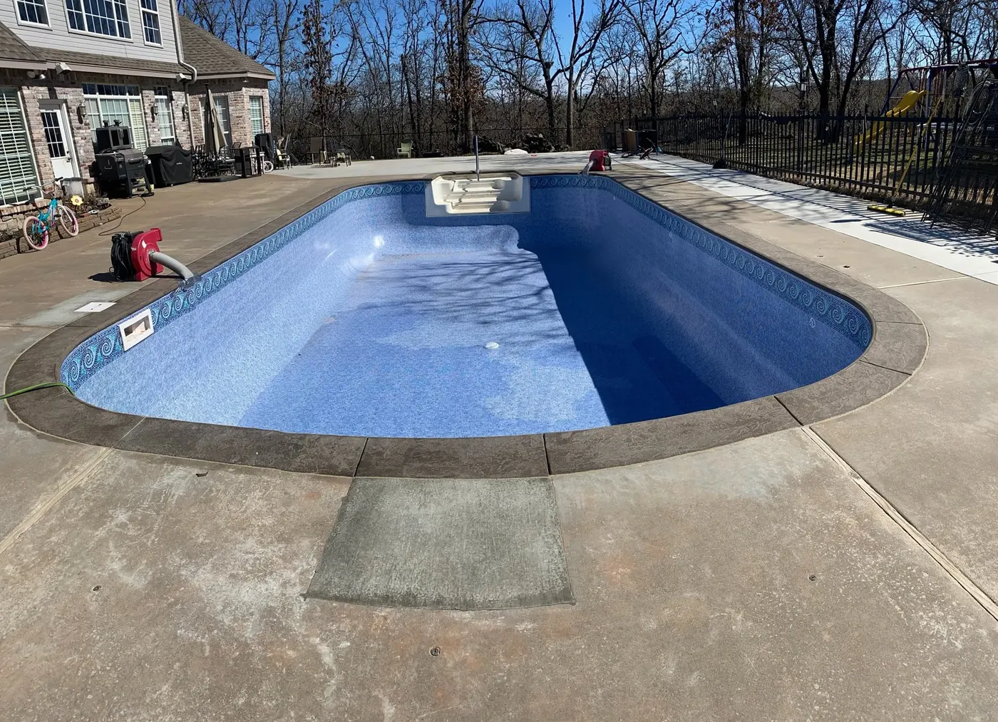 Same pool refilled with a new blue vinyl liner
