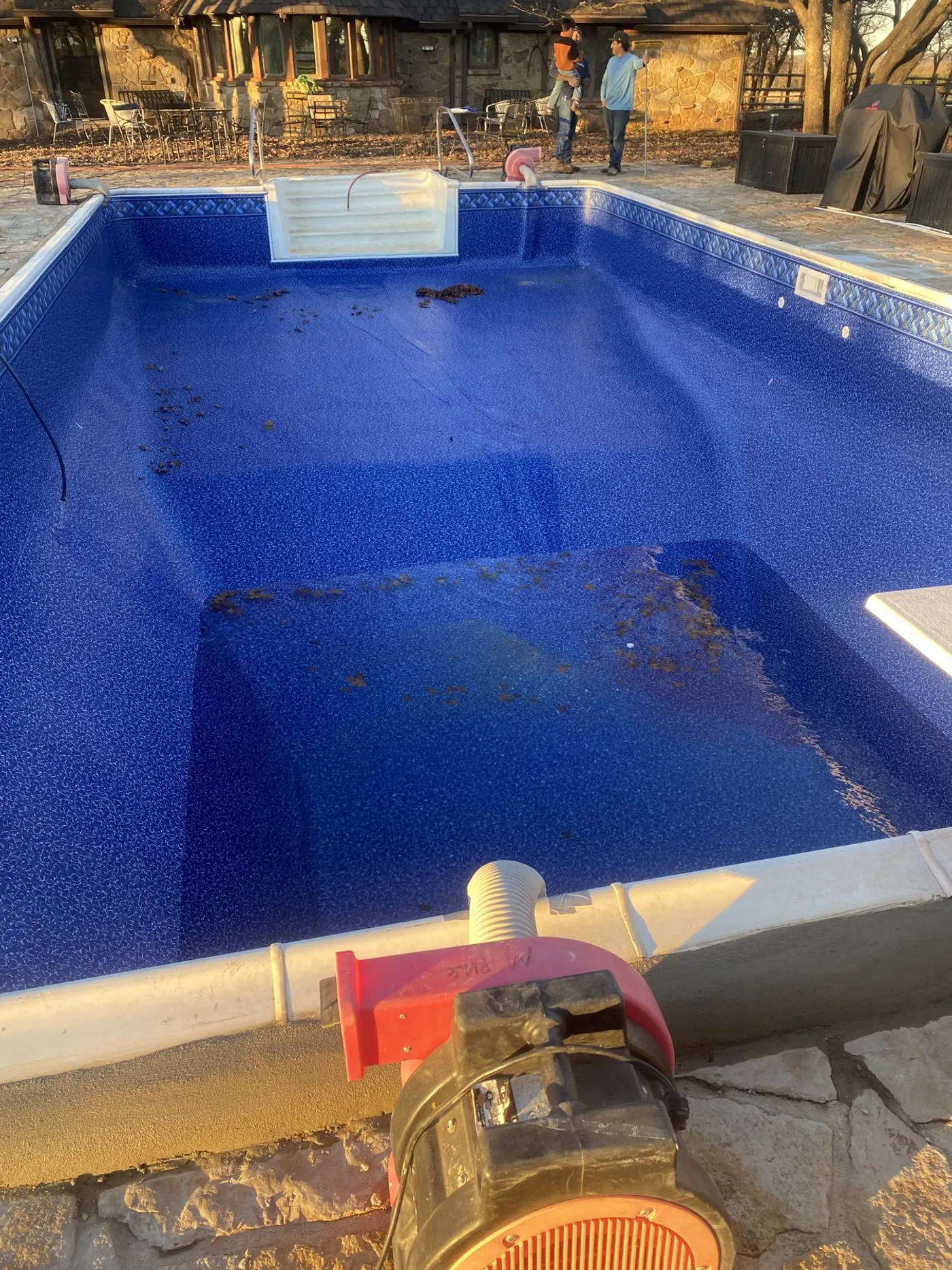 Same pool refilled with a new blue vinyl liner and a new skimmer