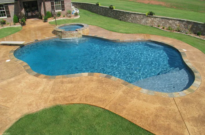 Pool installation with stone and landscape features