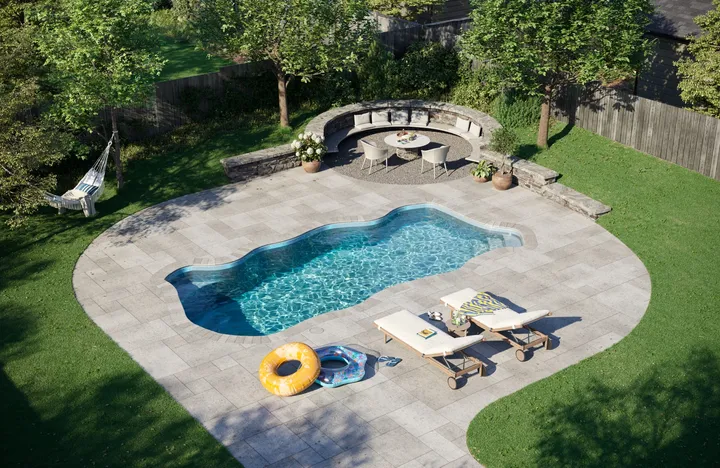 Latham Key West freeform fiberglass pool in a backyard scene — manufacturer rendering
