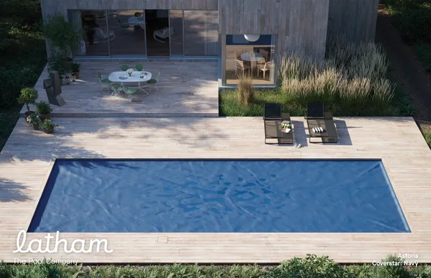 Evening view of a fiberglass pool and patio