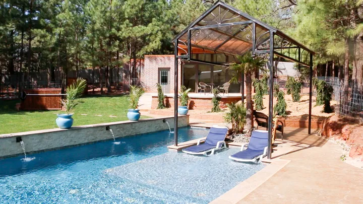 Close-up detail of pool water and deck showing professional finish and clean edges