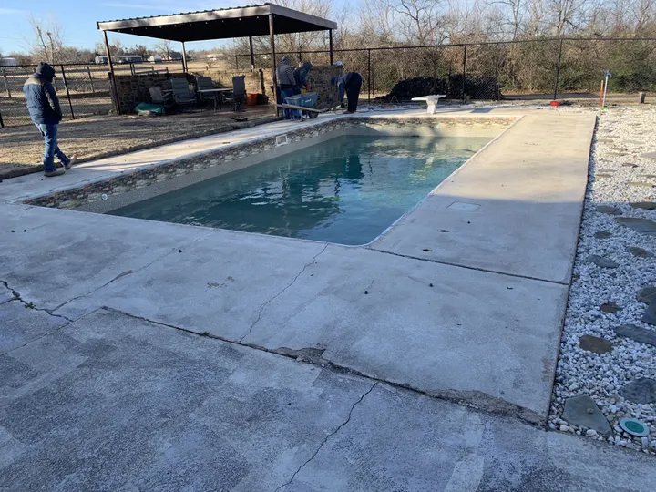 Renovation in progress: new deck poured and the pool refilling